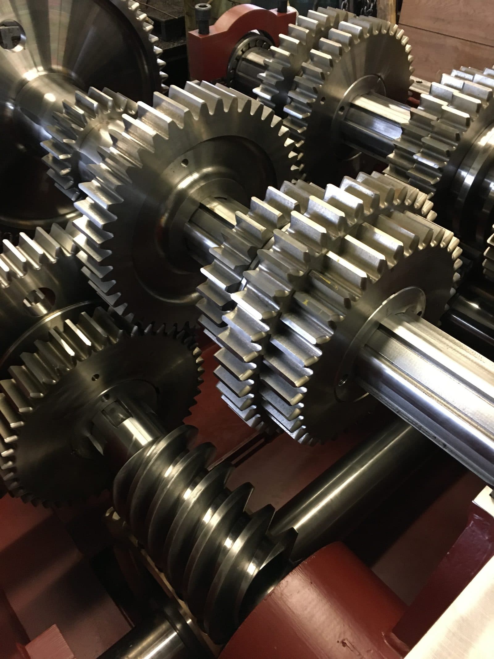Close-up of precision-machined gears and shafts inside an industrial gearbox